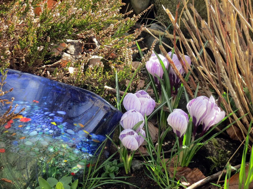 Glass art in the community garden (13205592125)