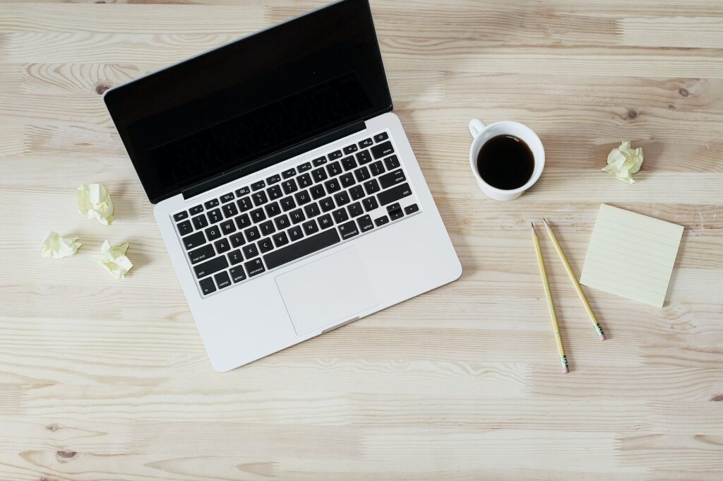 Laptop and coffee on a desk