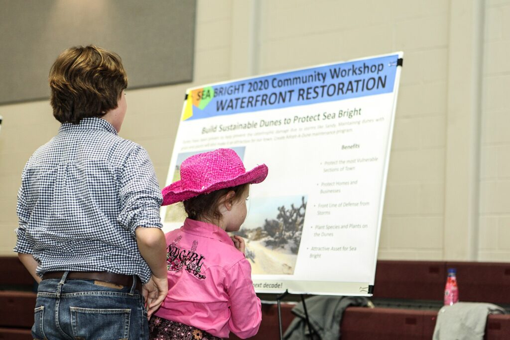 Rumson, N.J., Oct. 9, 2013â€”Families visit project boards developed by Sea Bright community members at the Sea Bright 2020 second community workshop. The workshop allows residents to speak with Project Advocates and vote to resolve community issues following Superstorm Sandy. Rosanna Arias/FEMA